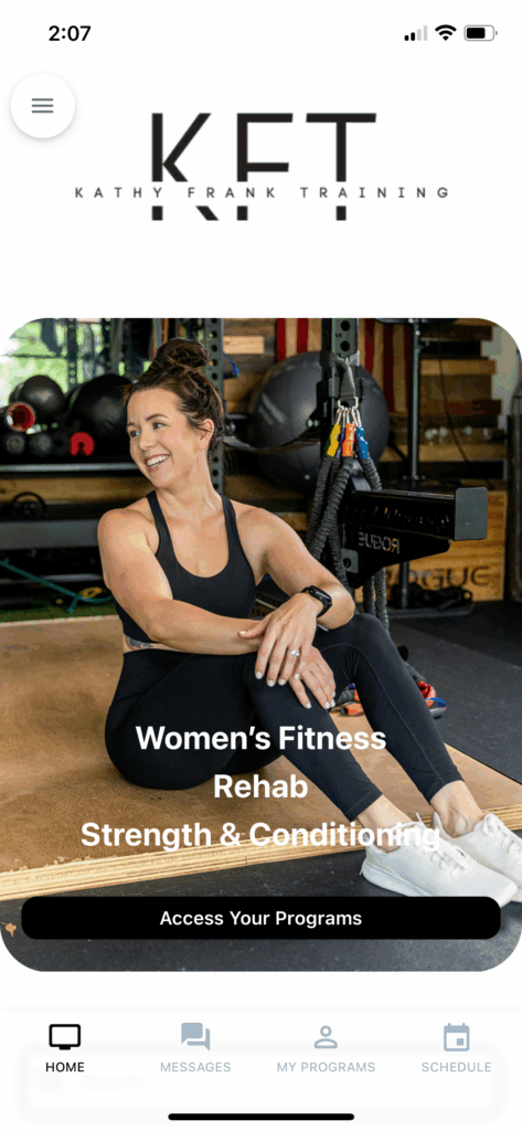 Virginia Beach personal trainer branding photoshoot in home gym with Rogue rack and baby swing